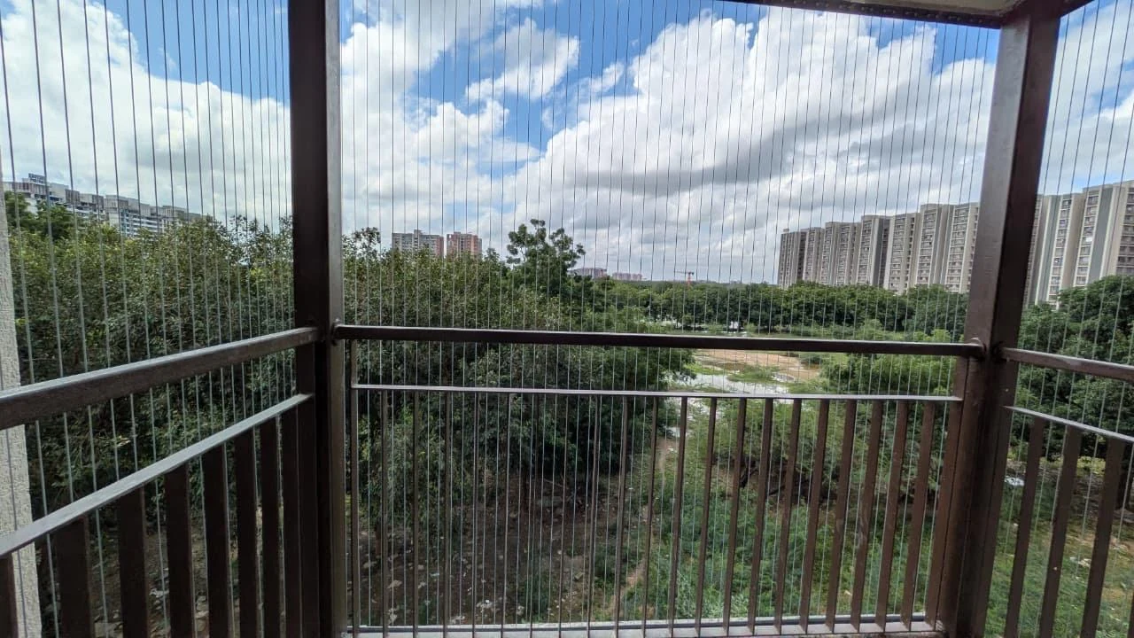 Invisible grill cables across a modern residential balcony