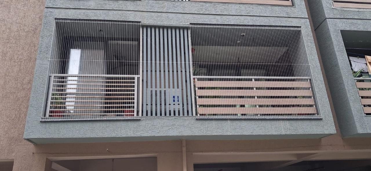Patel Enterprise invisible grill installation on a residential balcony